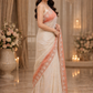 Beautifully crafted ivory and peach designer saree